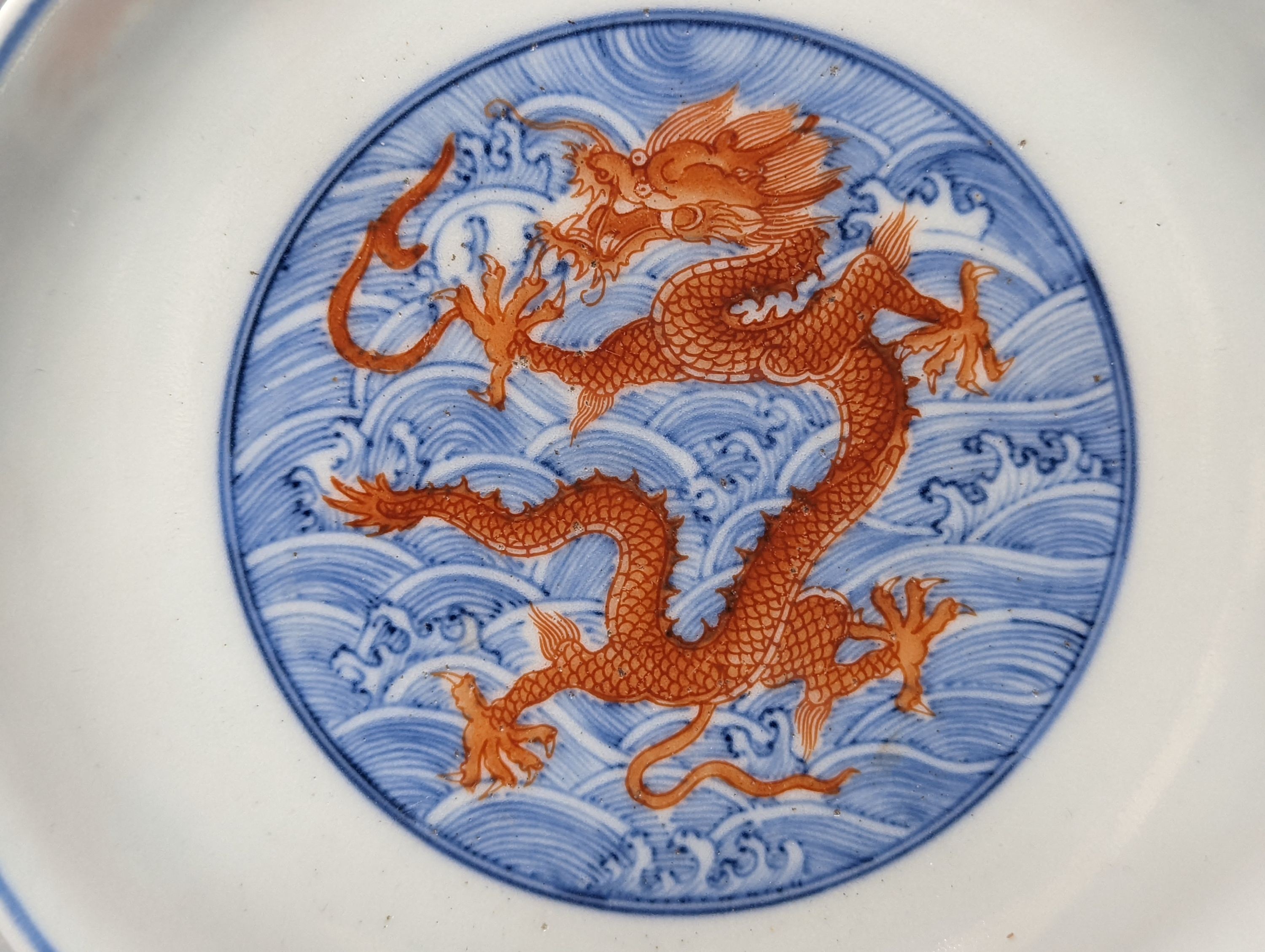 A Chinese blue and white dish with iron red dragons, Guangxu mark 18cm